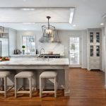 Long Gray Kitchen Island with Gray Upholstered Backless Stools