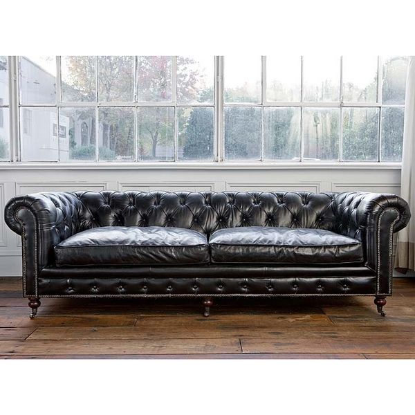 Beautiful black Chesterfield sofa. While this would probably