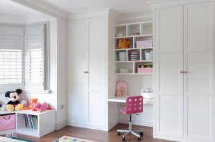 Floor to ceiling fitted #wardrobes with #desk area in #white satin