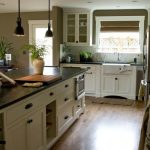 Kitchen color scheme: cream colored cabinets with dark hardware and