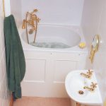 small bathroom idea with corner deep tub with gold-tone faucet stand