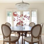 Round Dining Table With Vintage French Fabric Side Chairs In Back