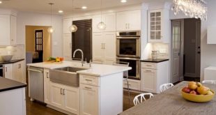 kitchen island with sink and dishwasher and seating | log cabin