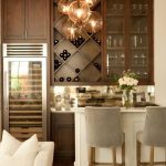 Chic living room bar features dark stained shaker cabinets paired