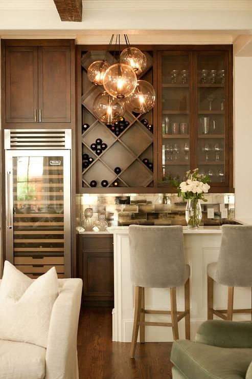 Chic living room bar features dark stained shaker cabinets paired