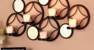 Décor your walls with appealing metal wall decor with candles or