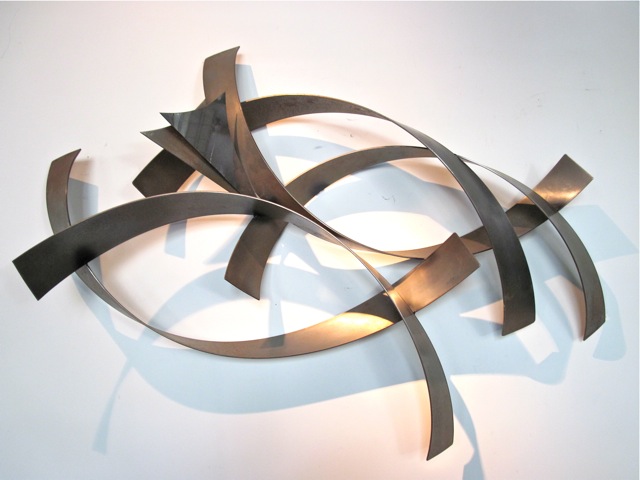 Get stylish designs of abstract metal wall sculptures to decorate