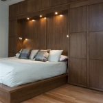 Bedwall with Built-in cabinet surround & hidden door