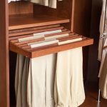 bedroom closet storage solution: wooden pull-out pants rack