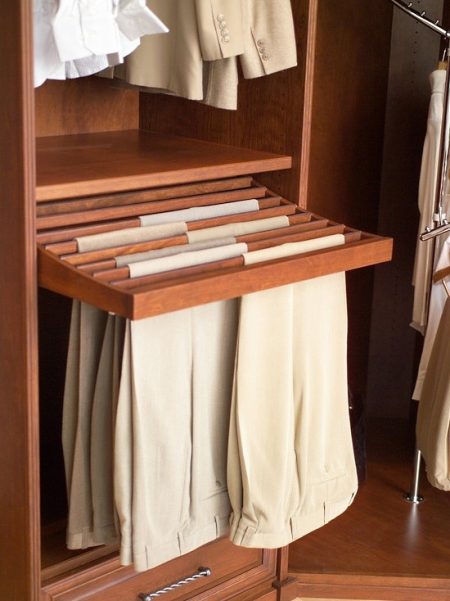 bedroom closet storage solution: wooden pull-out pants rack