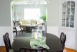 Traditional Dining Room with White Chandelier and Dark Table