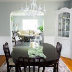 Traditional Dining Room with White Chandelier and Dark Table