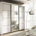 White wardrobes with sliding doors and mirrors: Stylish storage