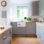 Country kitchen with grey painted cabinetry and wooden worktops | A