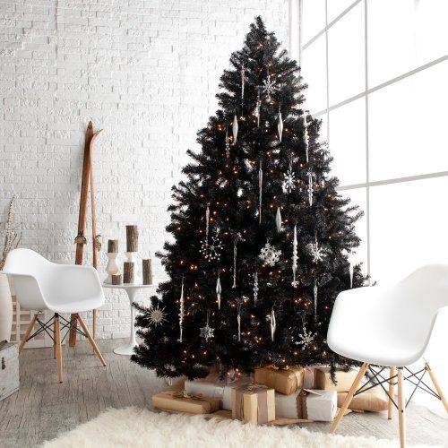 a black Christmas tree with white icicle and snowflake ornaments