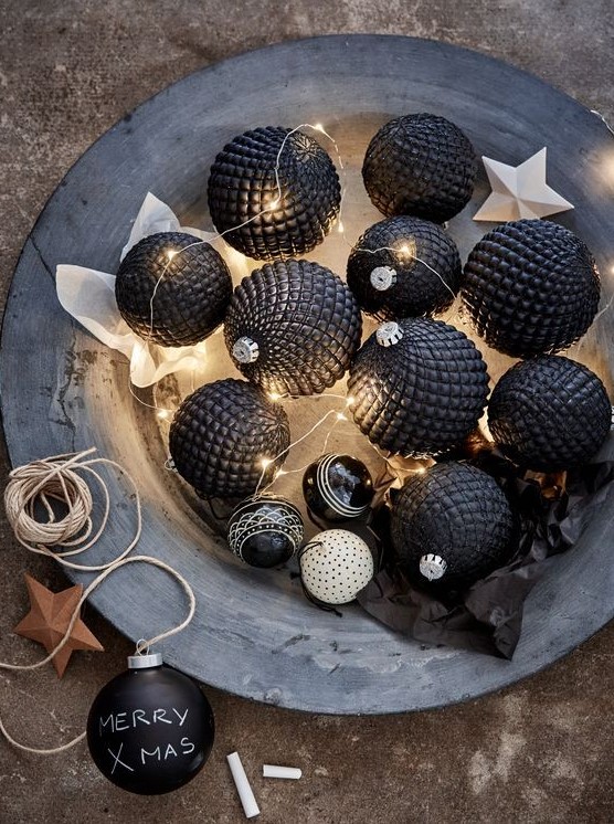 lovely textural and dimensional black Christmas ornaments and lights in a vintage bowl make up easy and beautiful Christmas decor