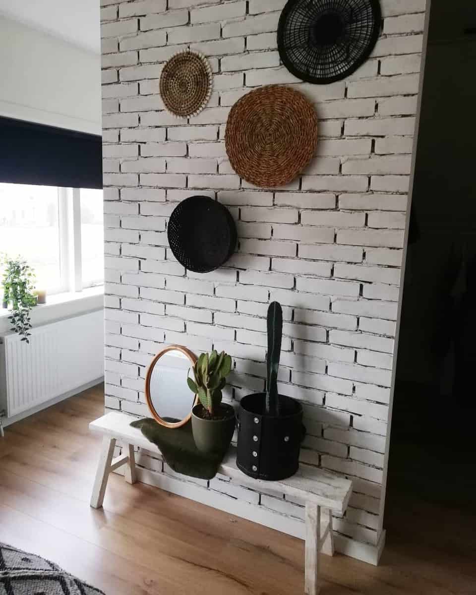 White brick bedroom wall with cactus 