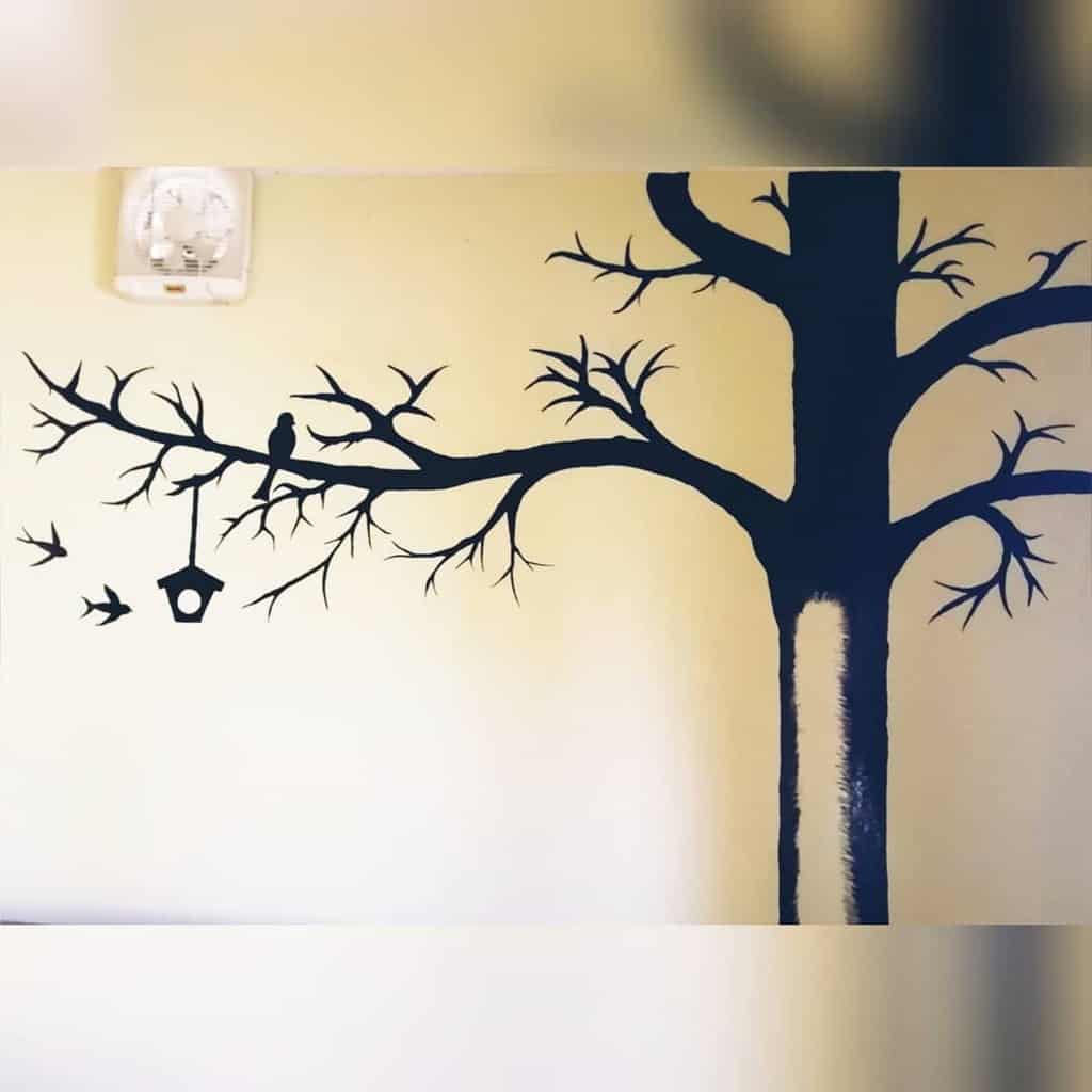 Photo wallpaper with black tree silhouette 