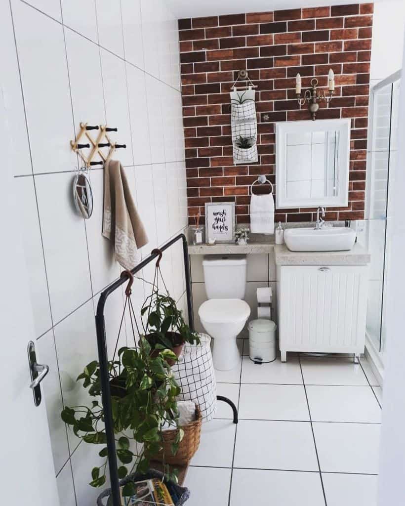 Rustic modern bathroom with white tiles and brick wall