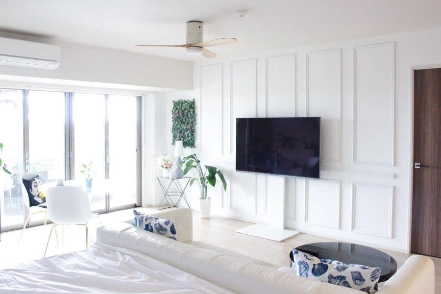 white wall paneling, white sofa in the bedroom 