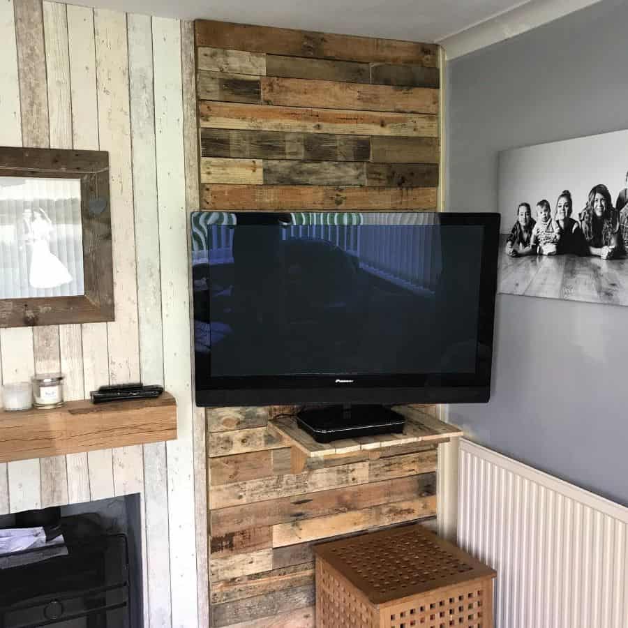 Wooden wall paneling with wall-mounted TV