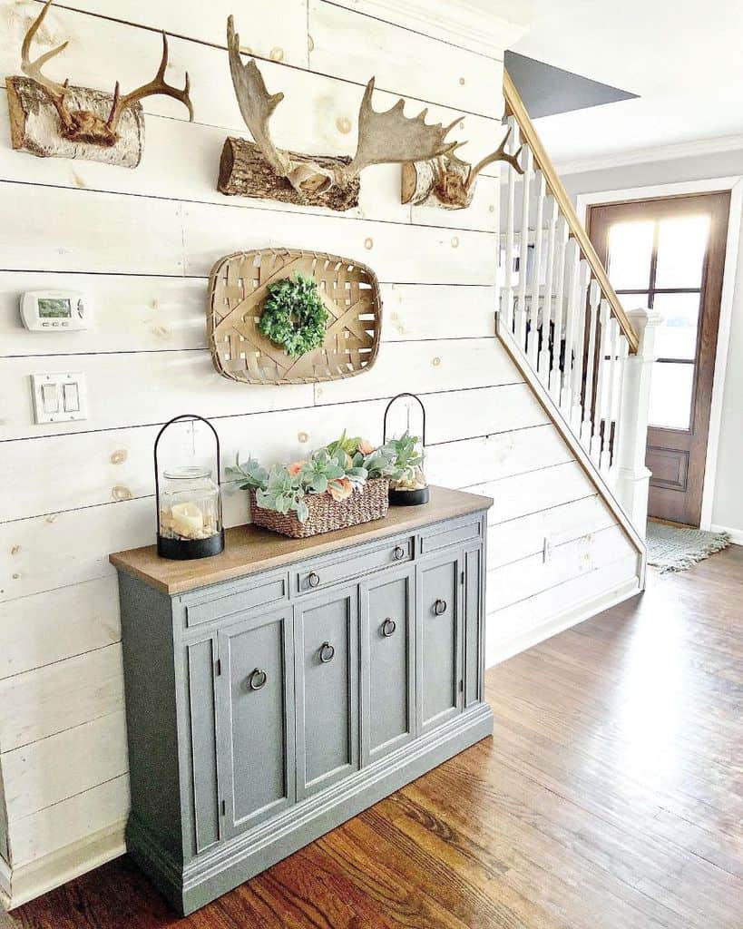 Country house hallway, gray cupboard, white shiplap wall