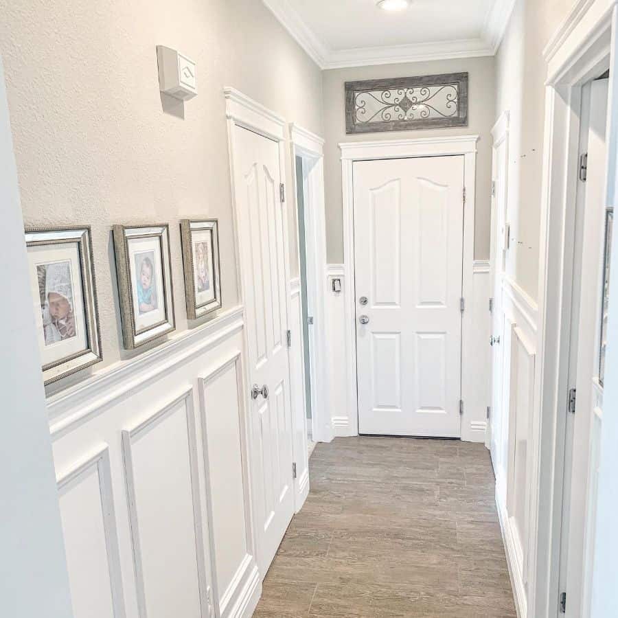White wall paneling in the hallway