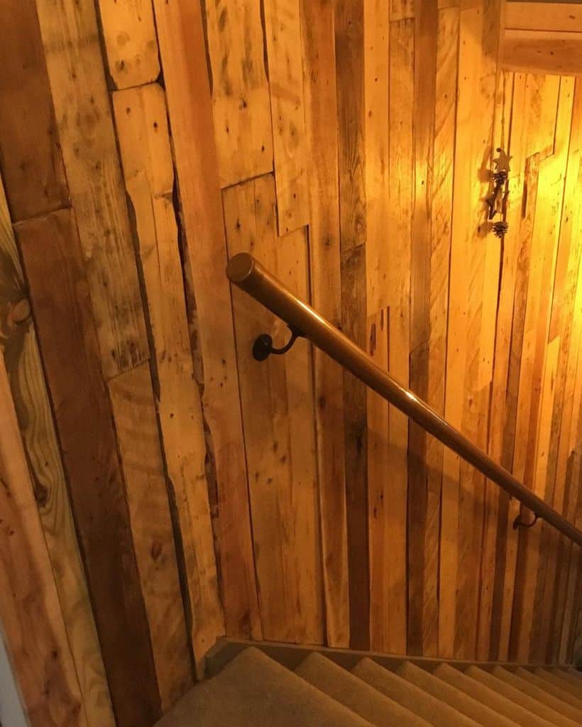 Wooden wall paneling for the stairs to the basement