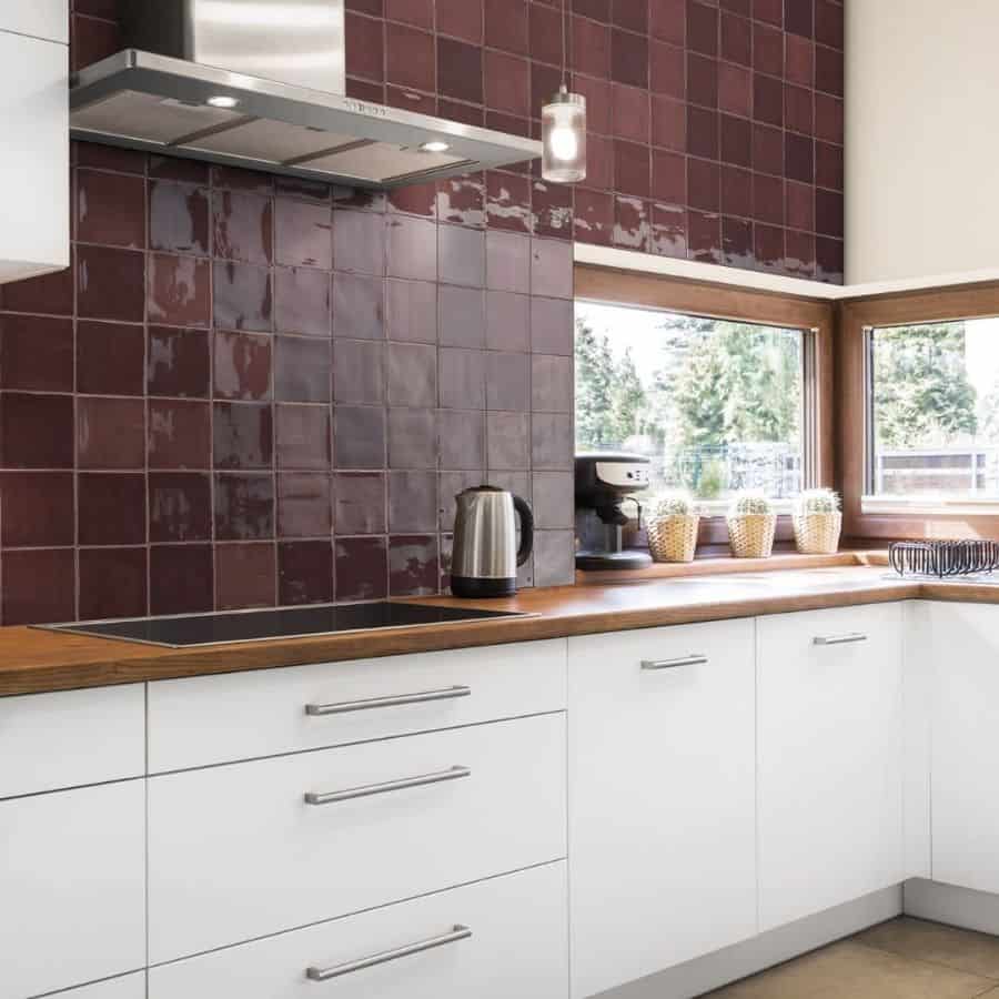 Kitchen back wall with red tiles 