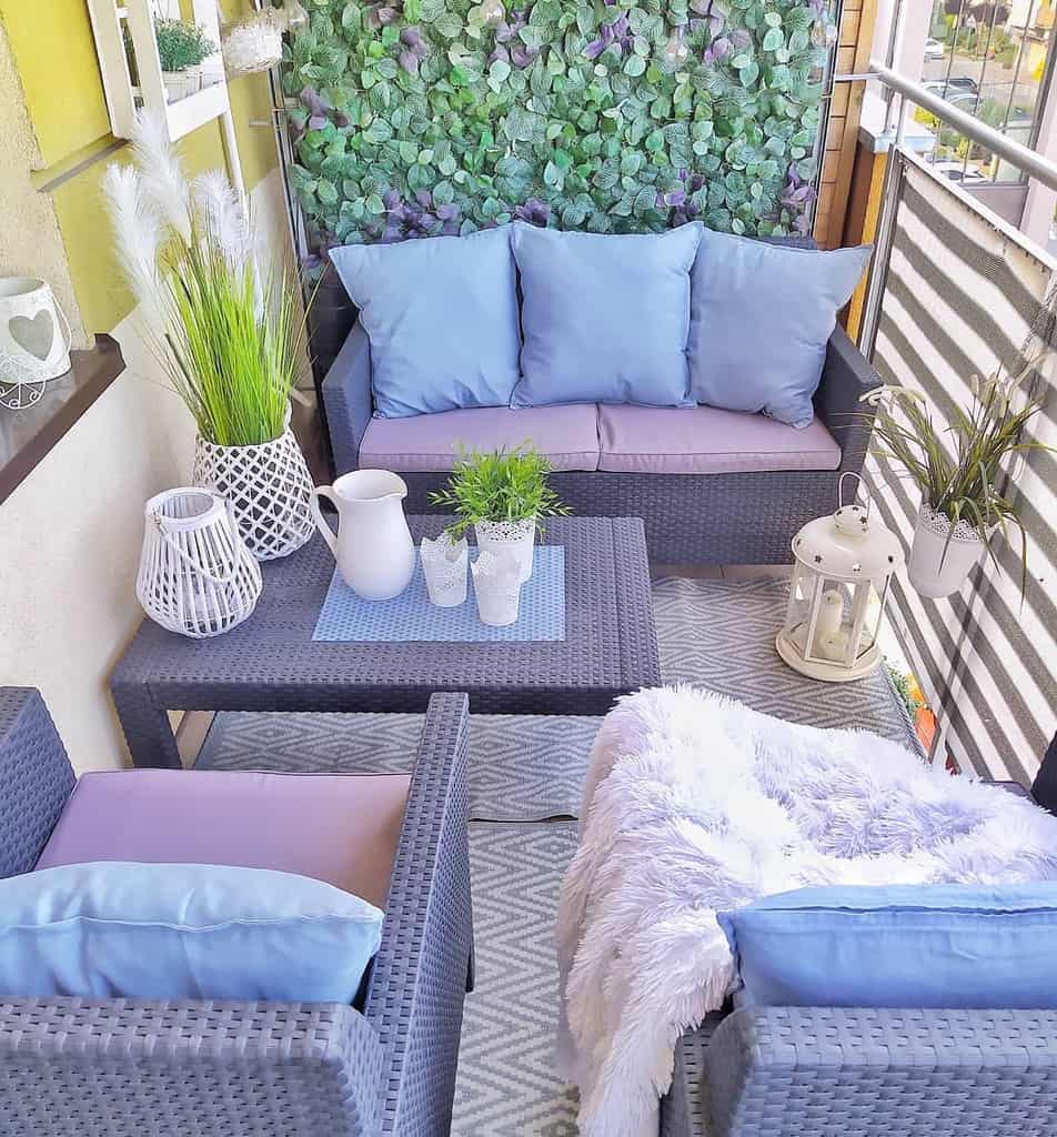 Pastel colored small balcony/patio with floor accent wall 