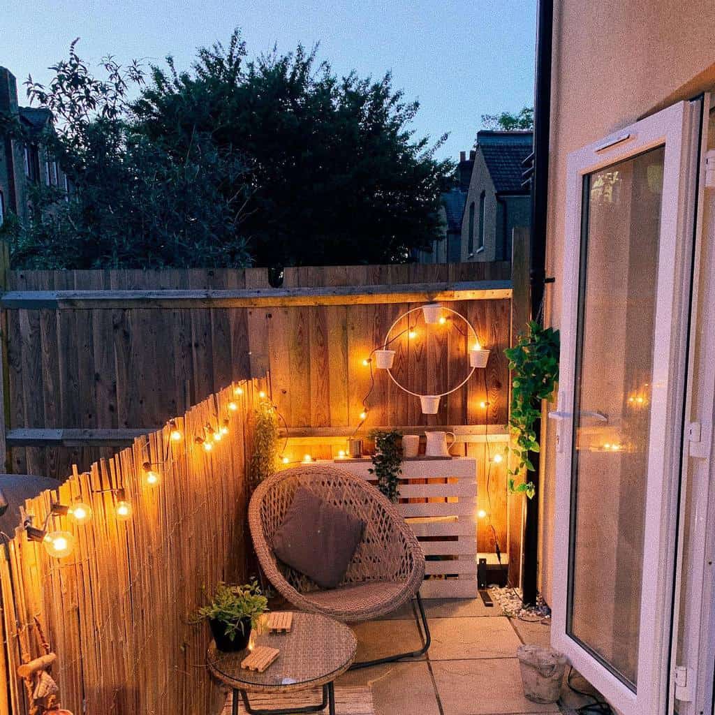 Small narrow backyard patio with bamboo privacy fence 