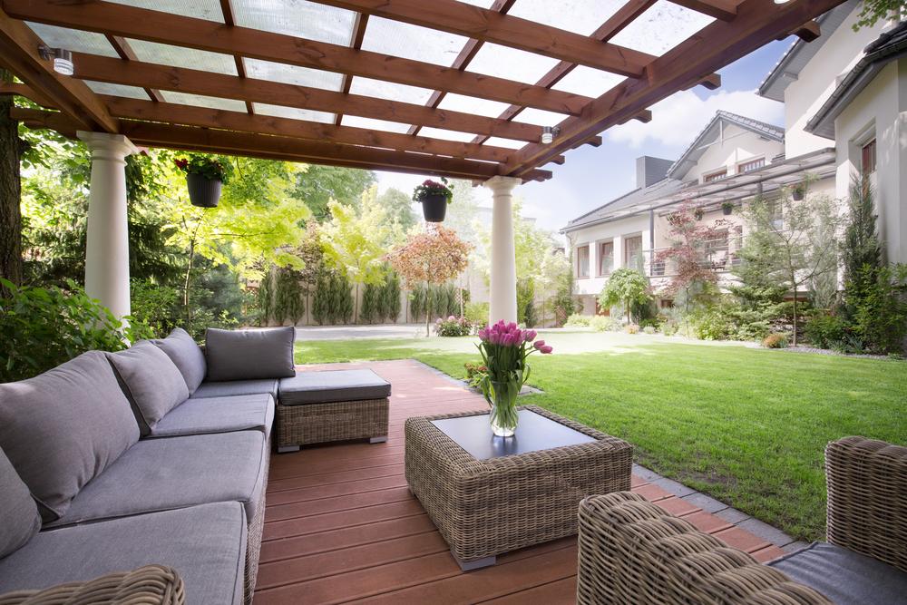 Install a pergola to provide shade and enhance your backyard design’s aesthetic