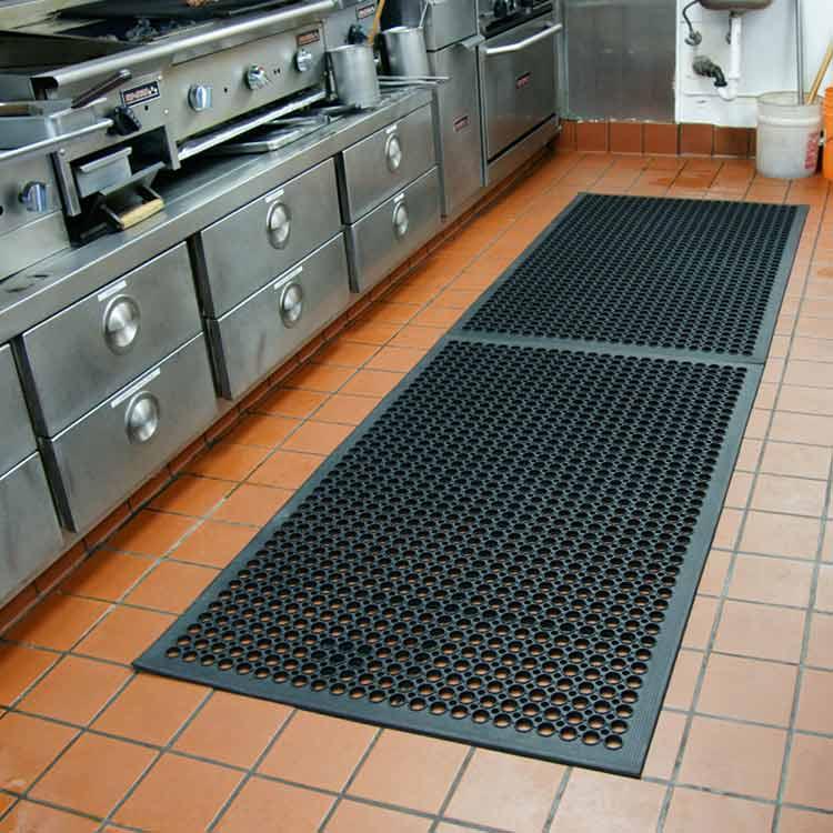 Floor mats minimize slipping‍ hazards‍ in a bustling industrial kitchen environment