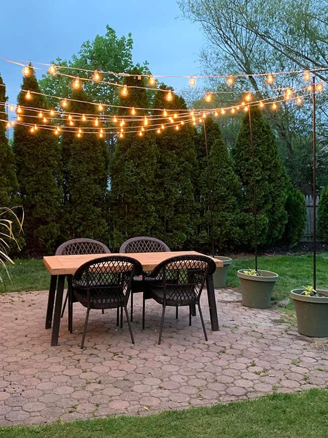 Hang string ‍lights to add warmth and ⁢charm to ⁢your modern backyard evenings