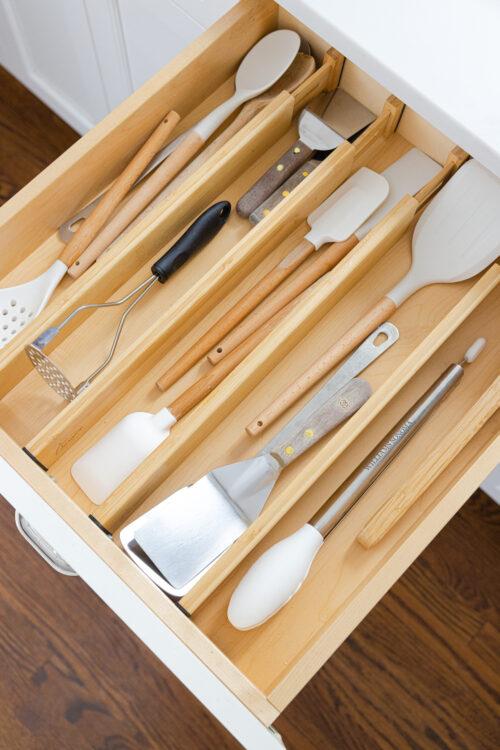 Use drawer dividers to keep utensils organized in your galley kitchen