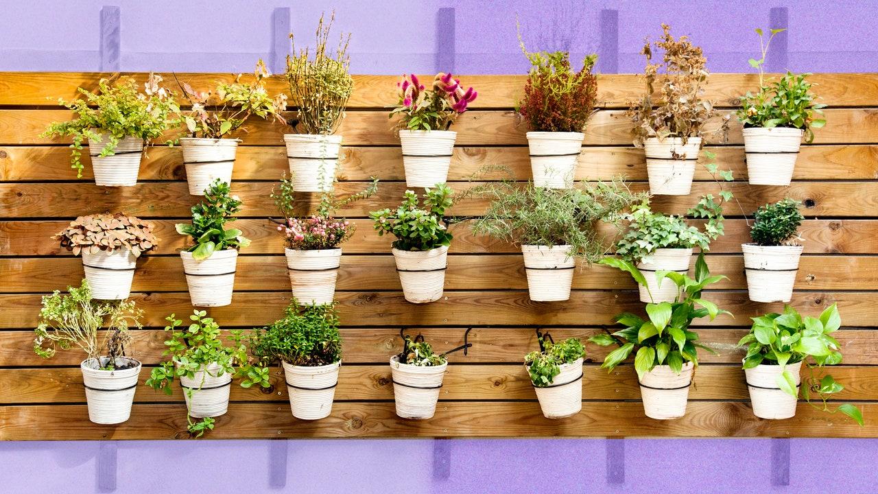 Add potted plants for greenery without sacrificing ‍space in your⁢ Small Patio Design