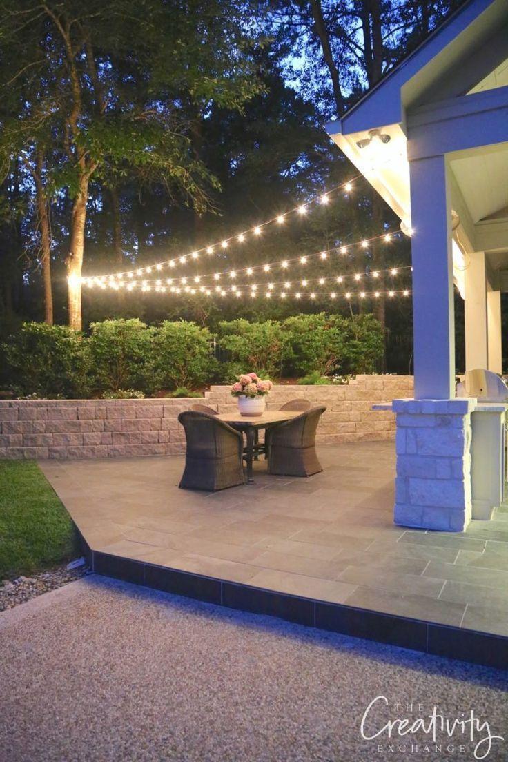 Hanging lights create a magical ambiance in your evening patio design