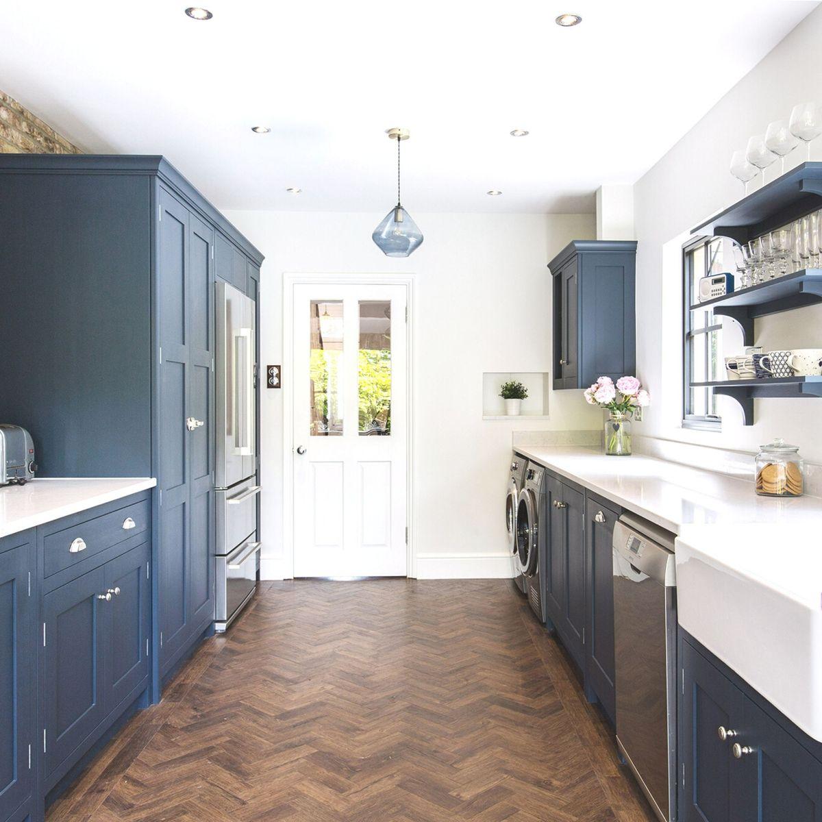 Use bright colors and light finishes to create an illusion of space ​in your Galley Kitchen