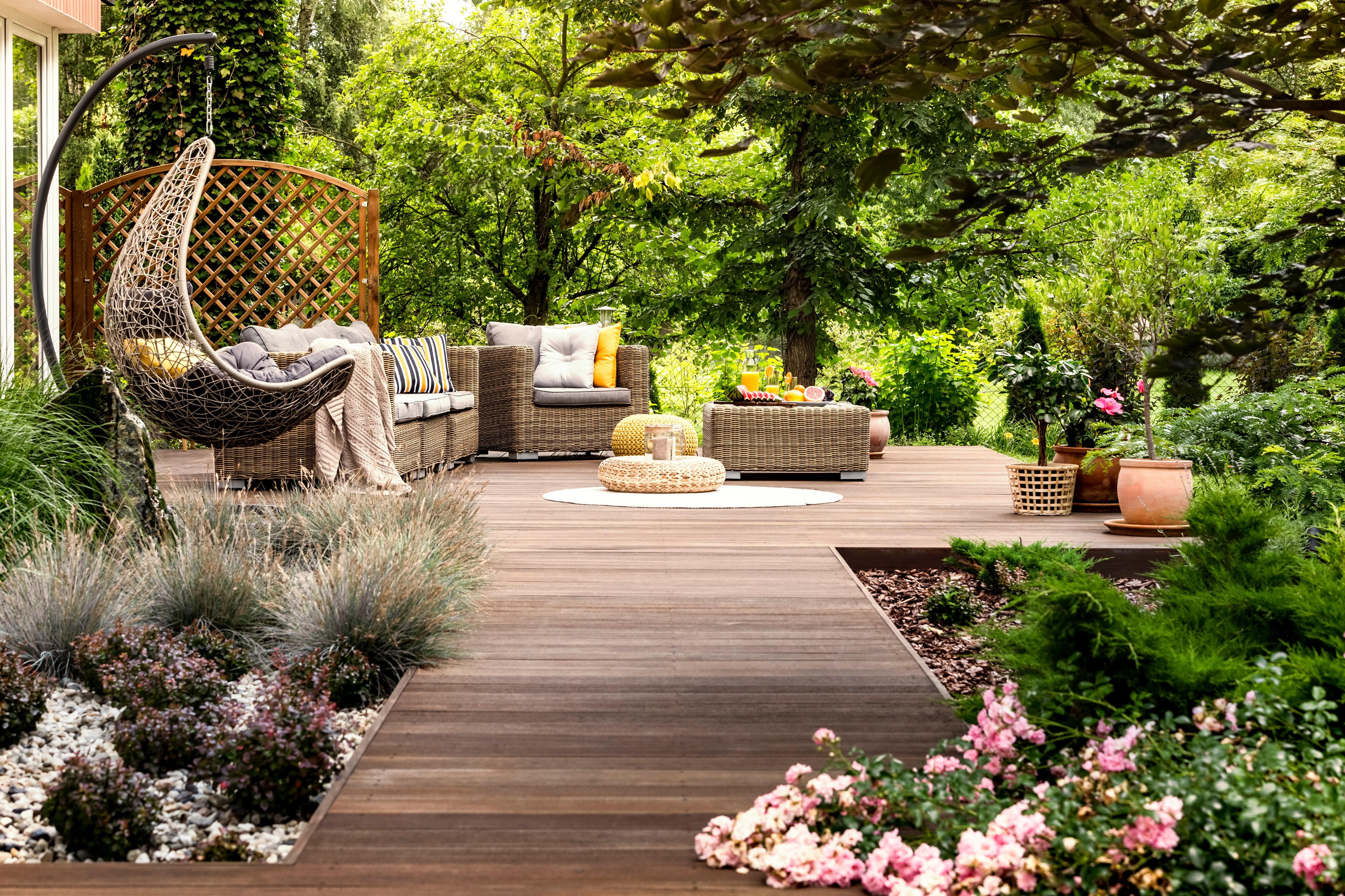 Create cozy seating areas nestled among lush greenery in your landscaping design