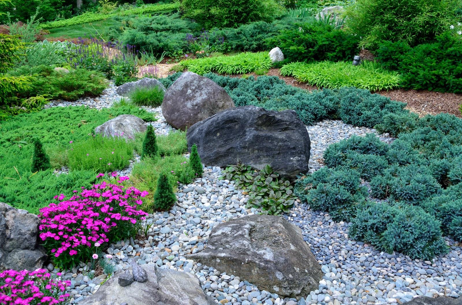 Use decorative stones for a contemporary twist in your front yard design