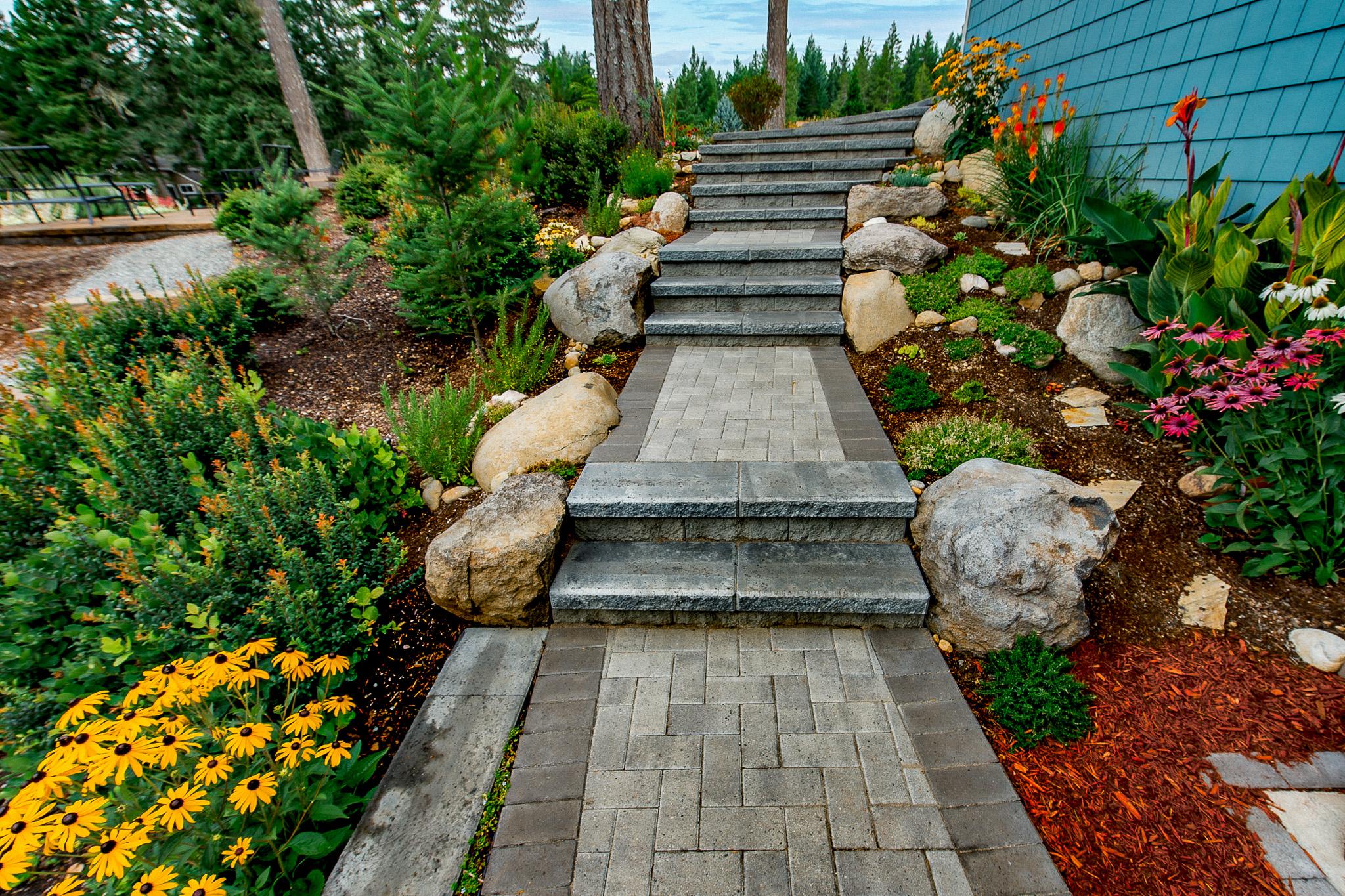 Use natural stone pathways to enhance your landscaping design with rustic elegance