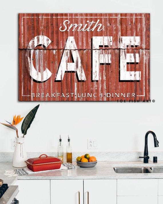 Charming ​wall art enhances the cozy feel of your country kitchen