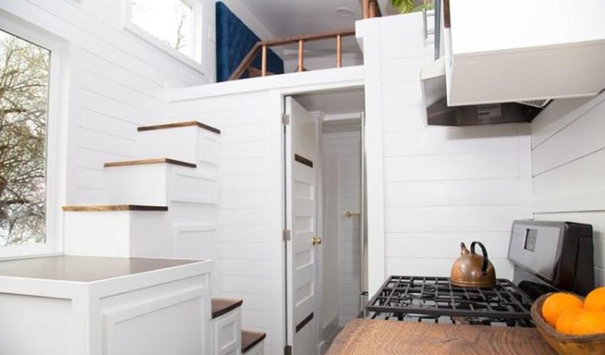 Use vertical storage in your Under Stairs Kitchen to maximize every inch of space