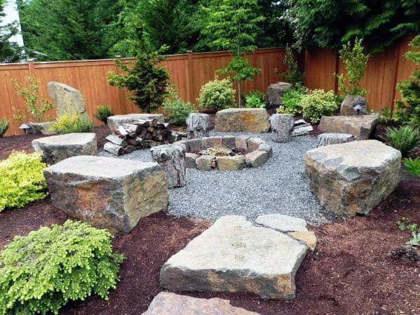 Design a cozy fire pit area as a focal point in your landscaping design