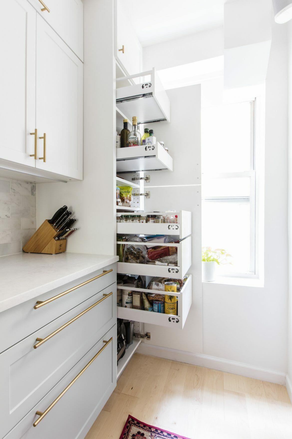 Invest in pull-out cabinets for seamless storage in your galley kitchen