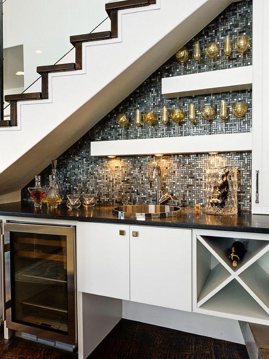 Place a wine cooler under stairs kitchen for a dedicated wine storage solution