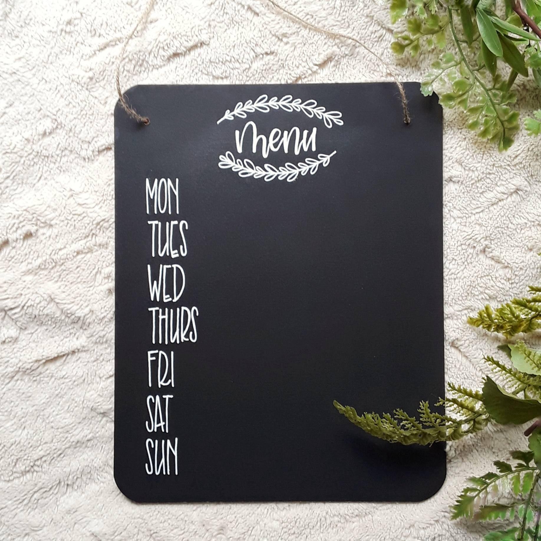 Customized chalkboards keep your farmhouse kitchen ​organized and personalized