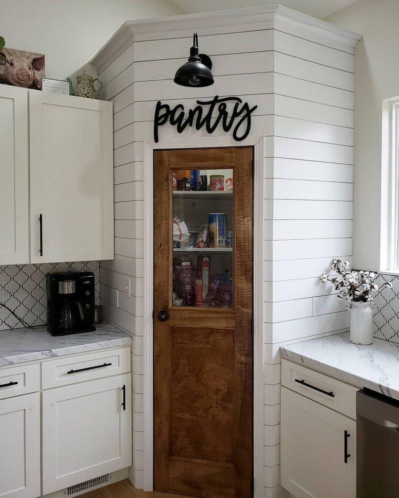 A classic pantry door ​adds rustic elegance to your country kitchen entry