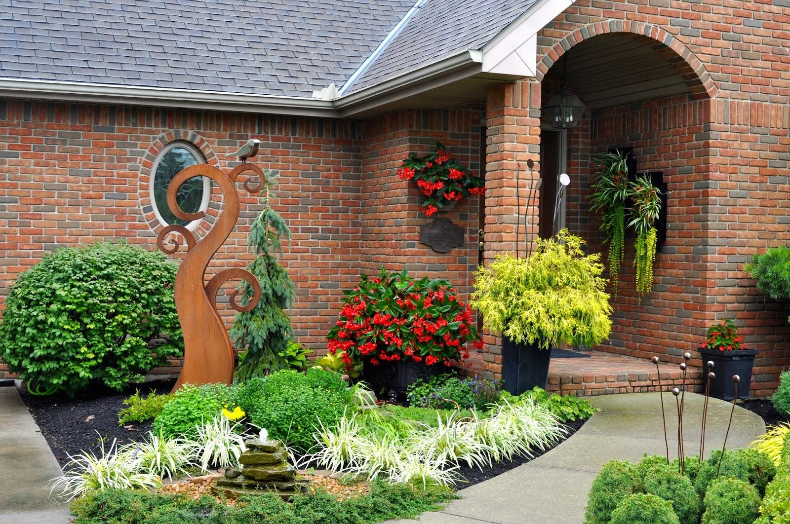 Integrate artistic sculptures for a unique focal point in your front yard design