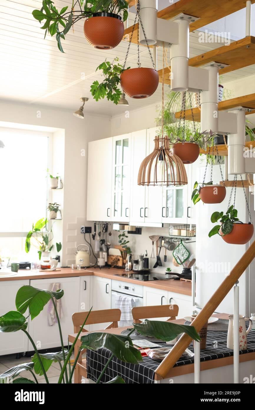 Maximize‍ wall space with hanging pots in your under stairs ⁣kitchen